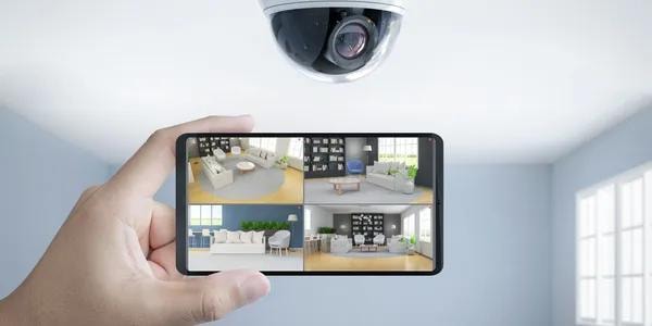 Security camera monitoring multiple rooms on smartphone